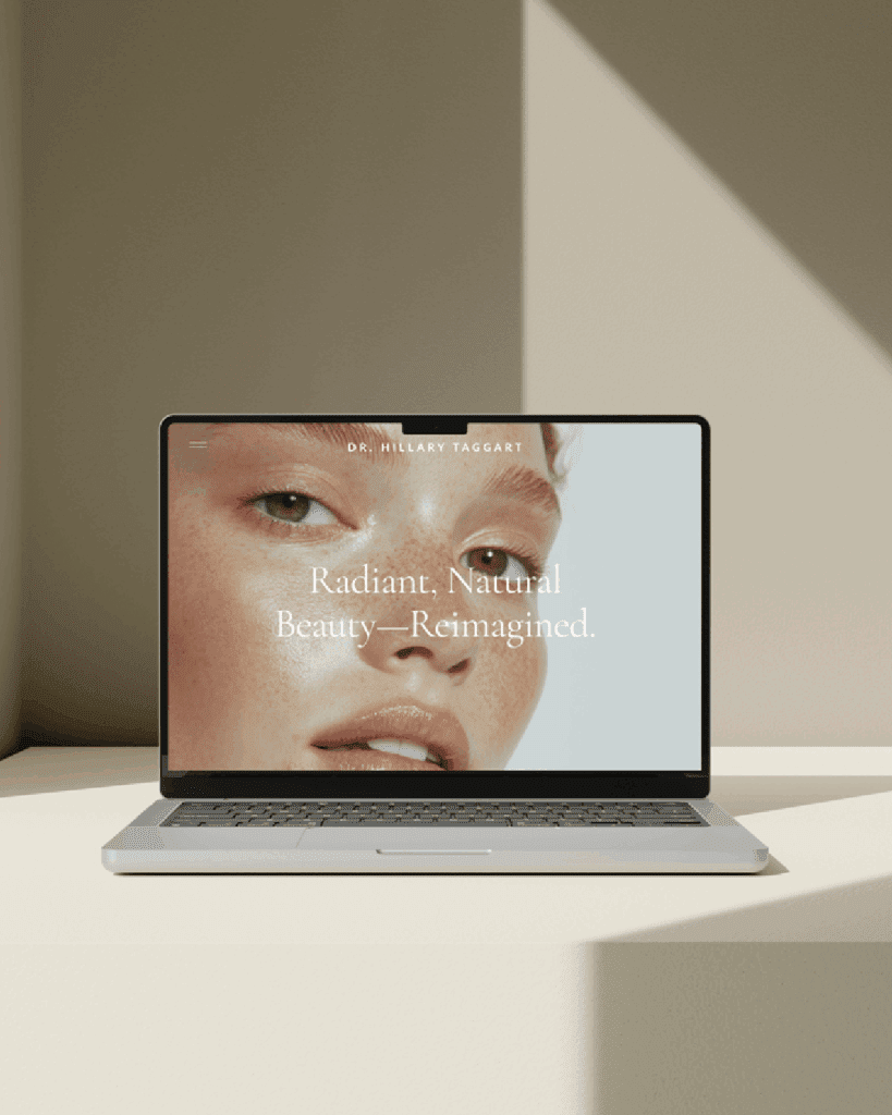 Laptop mockup featuring the Dr. Hillary Taggart homepage with the tagline “Radiant, Natural Beauty—Reimagined.”