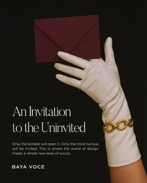 Baya Voce brand concept showing a gloved hand holding a burgundy envelope, symbolizing mystery and invitation to a luxury brand world.