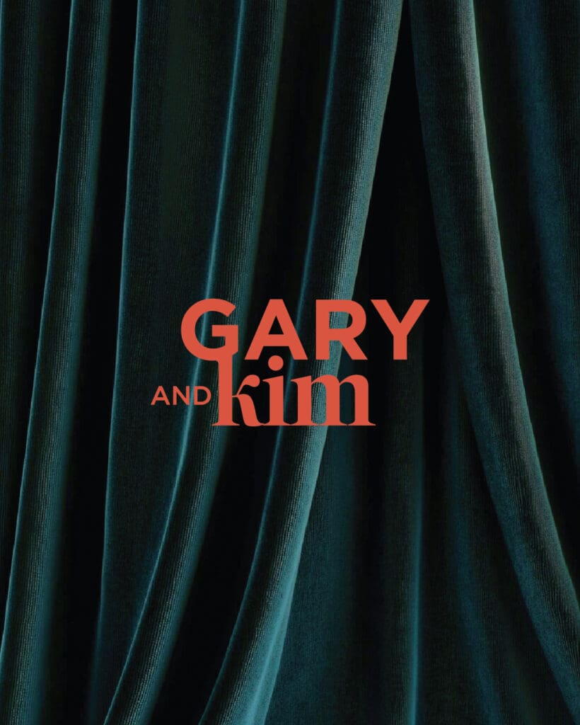 Alternate logo version for Gary and Kim in bold red against rich velvet drapery, showcasing the dramatic, editorial tone of the brand.