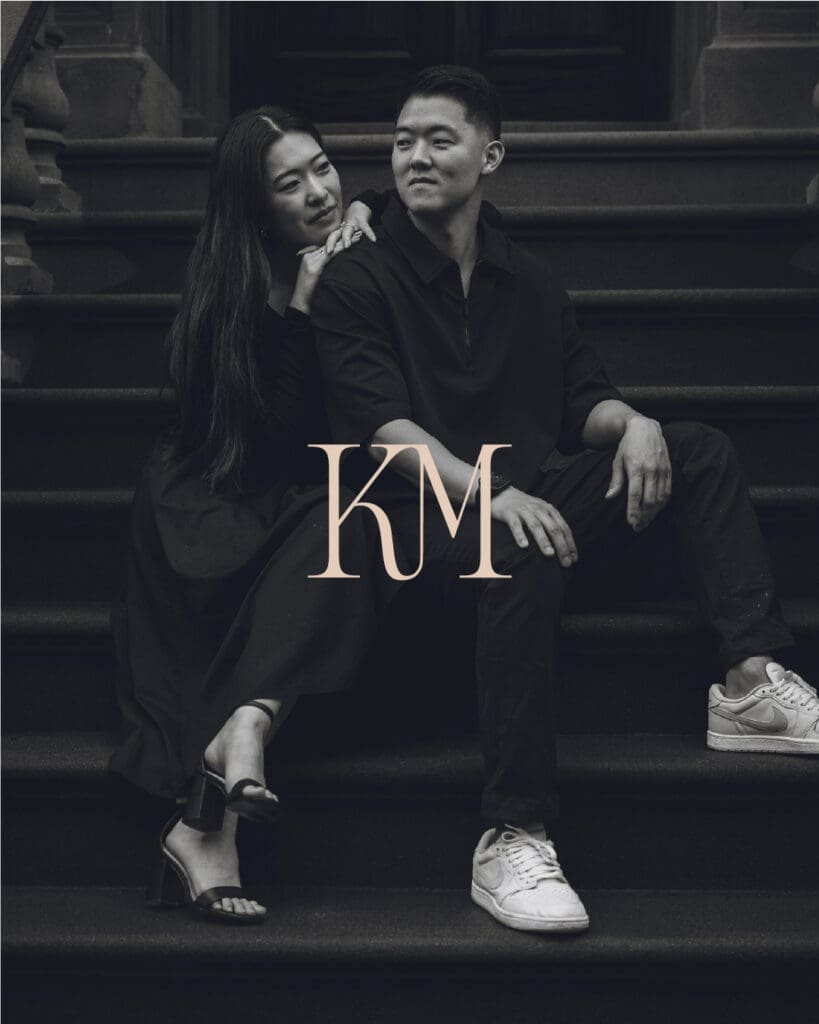 Monogram logo for Karen Michelle Photography over a candid black and white engagement portrait.