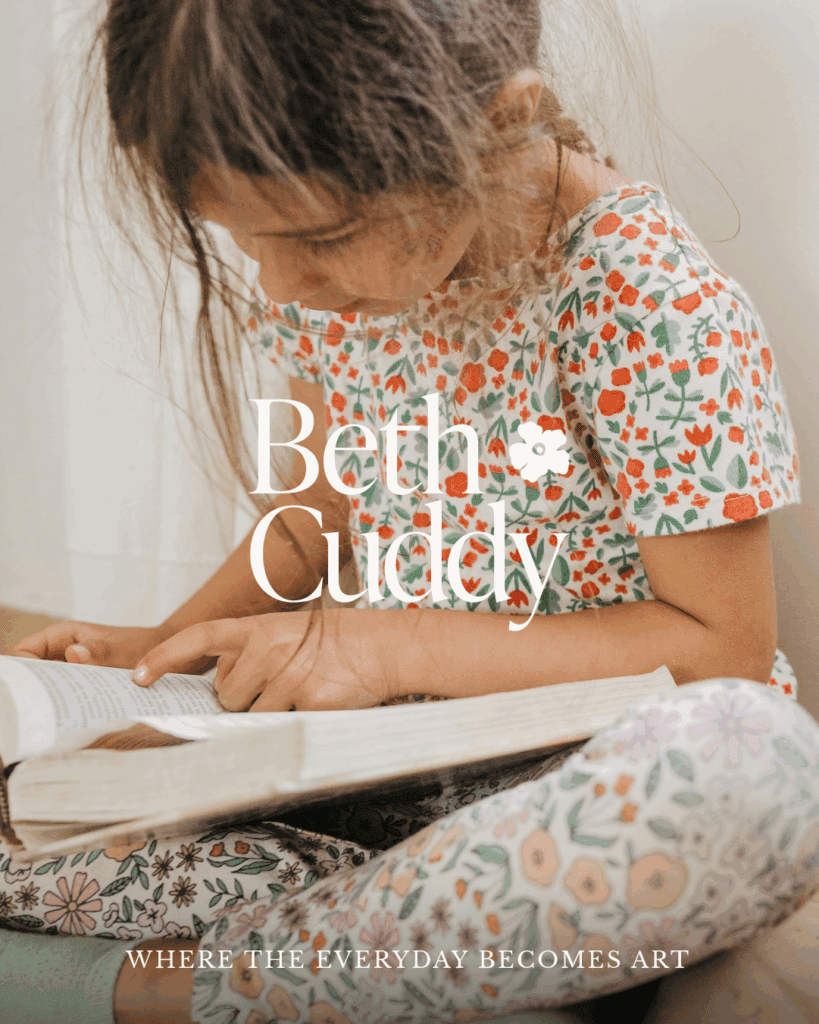 Young girl in floral pajamas reading a book, overlaid with Beth Cuddy’s logo and tagline: “Where the everyday becomes art.”